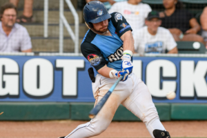 Ouzts Clubs Three Homers as Blowfish Fall Against Bacon 8-7